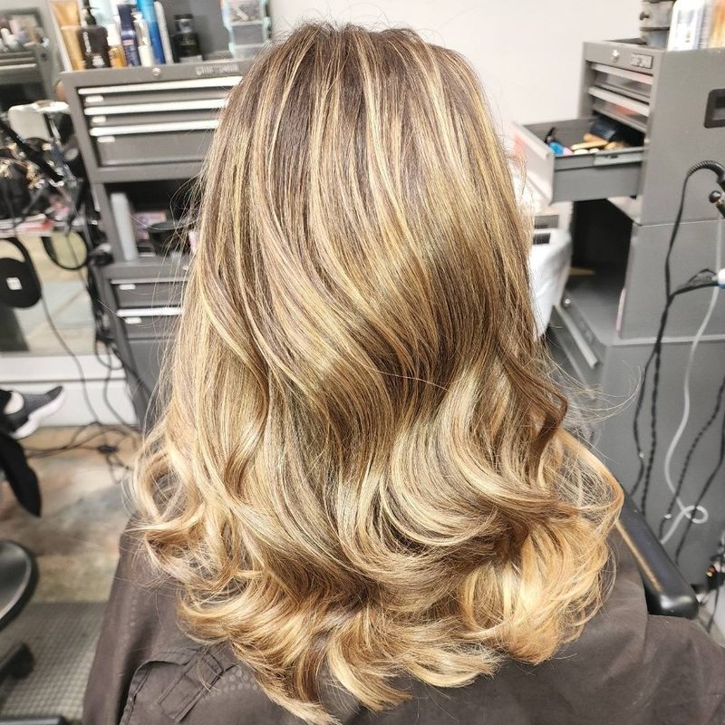 Buttery blonde balayage with lived in roots